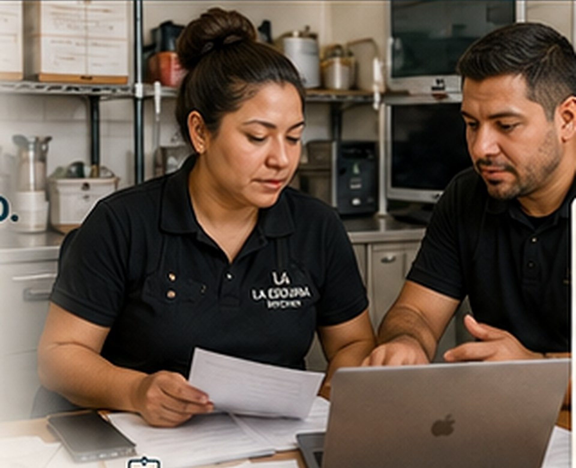 Small business operators reviewing payroll information